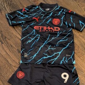 Puma Kids Manchester City Haaland Jersey Black Jersey with Blue Accents